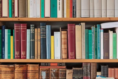 Part of a bookshelf containing books by ancient philosophers 1.1